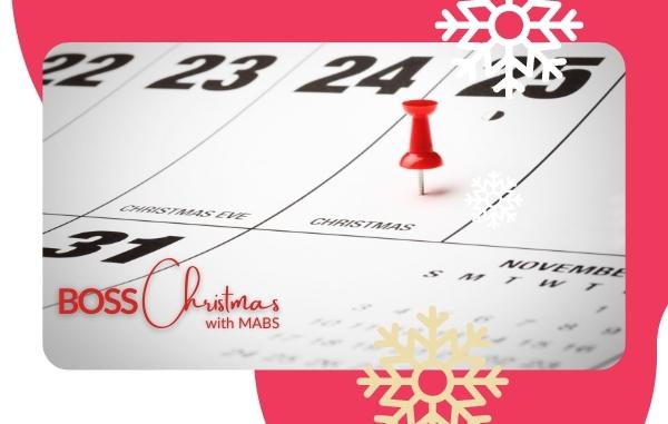A close up a calendar focused on a red pin signifying Christmas day