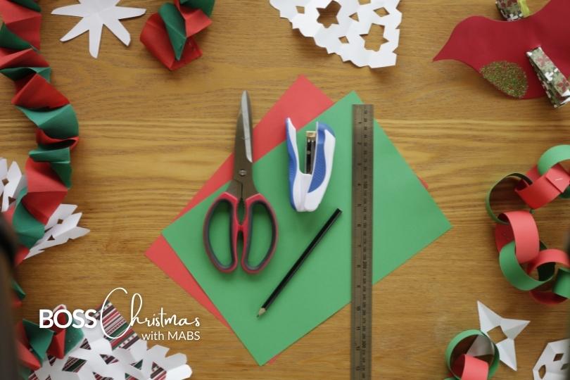 arts and crafts on a table to make Christmas decorations