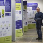 Man looking at MABS exhibition stand