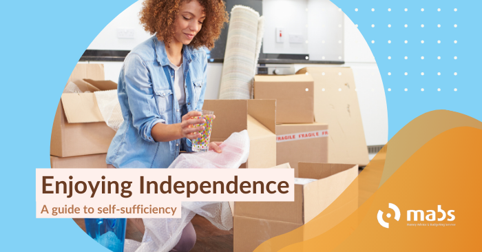 Cover image for blog post. Text reads "Enjoying Independence - a guide to self-sufficiency". Centre image holds a woman unpacking boxes in her new home.