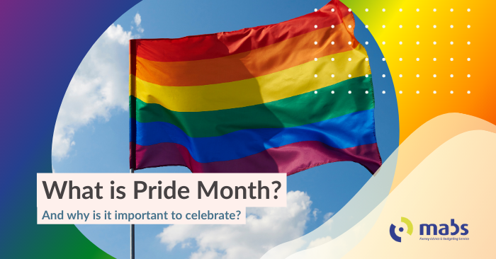 Cover image is Pride themed. The background is a gradient of the pride colours. In the center image holds a picture of a pride flag blowing in the wind. The caption reads "What is Pride month? - and why is it important to celebrate?" 