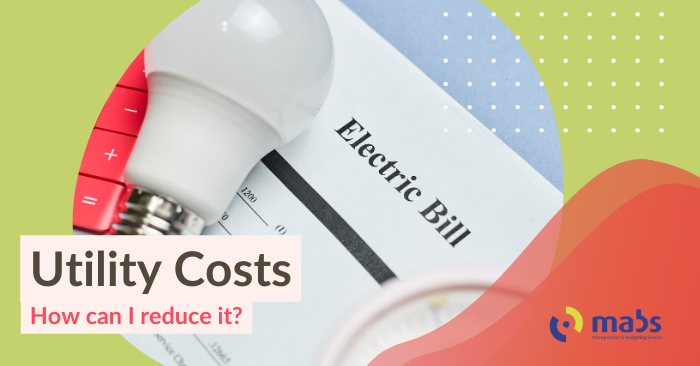 Cover image for blog post. Text reads "Utility Costs - How can I reduce it?". Center image holds an image of a light bulb on top of a piece of paper that reads 'Electric Bill'.