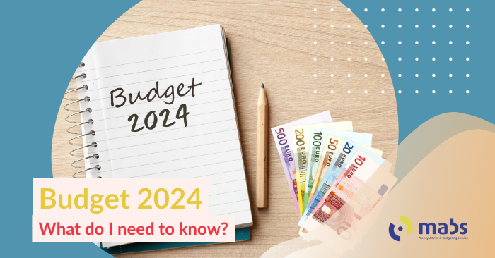 Blog cover image holds an image in the center of a notepad with "Budget 2024" written on the page, pencil and euro notes. The text on the cover photo reads "Budget 2024 - What do I need to know?"